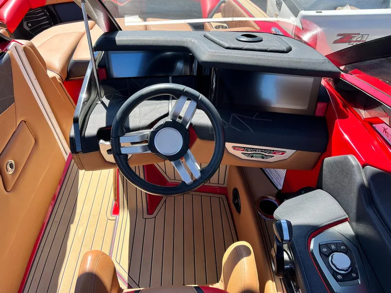 Slide: The Image of 2021 Nautique Super Air Nautique G25 Paragon dashboard with sleek steering and modern controls. - 45