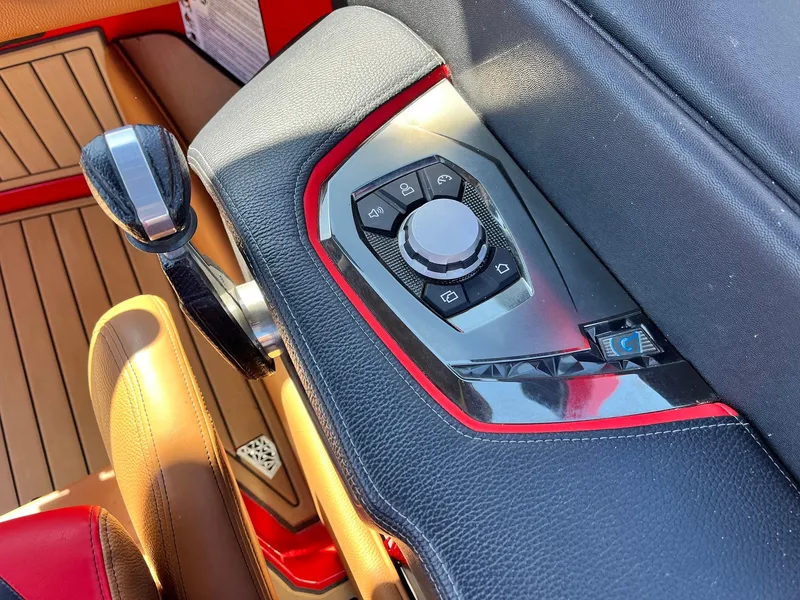 Slide: The Image of Control panel of 2021 Nautique Super Air Nautique G25 Paragon with sleek design and red accents. - 46