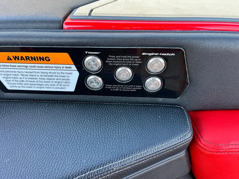 Slide: The Image of Control panel of 2021 Nautique Super Air Nautique G25 Paragon with warning label and buttons. - 47