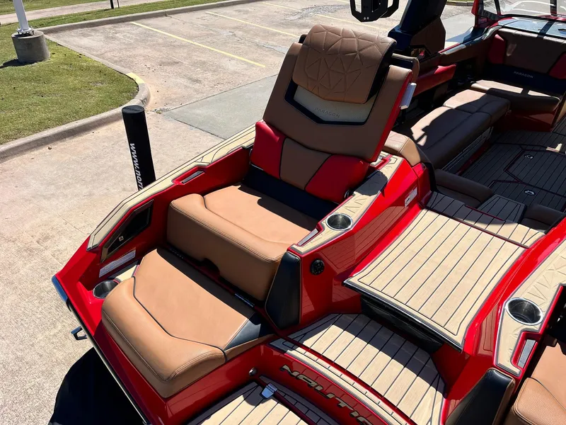 Slide: The Image of 2021 Nautique Super Air Nautique G25 Paragon boat with luxurious seating and red accents. - 48
