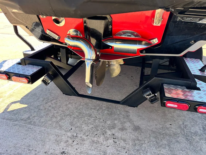 Slide: The Image of 2021 Nautique Super Air Nautique G25 Paragon boat trailer hitch and propeller detail. - 6