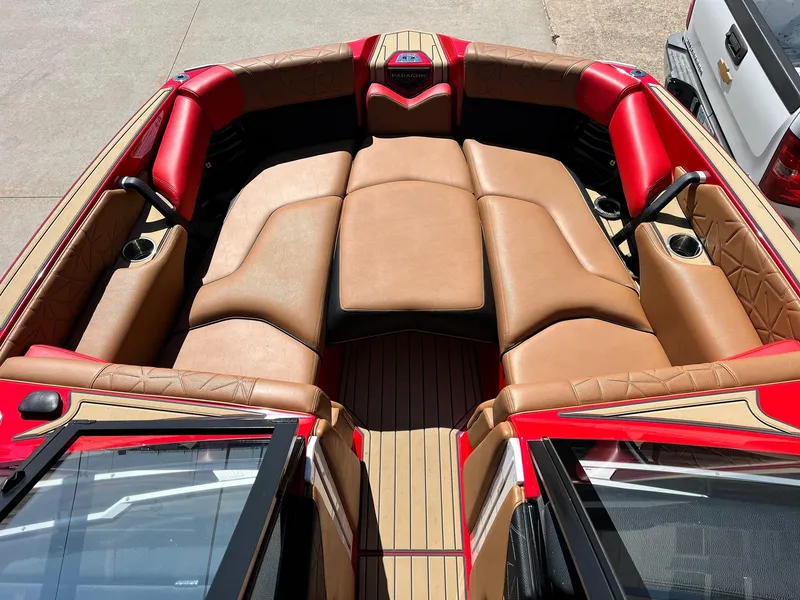 Slide: The Image of Luxurious interior of 2021 Nautique Super Air Nautique G25 Paragon boat with tan and red seating. - 9