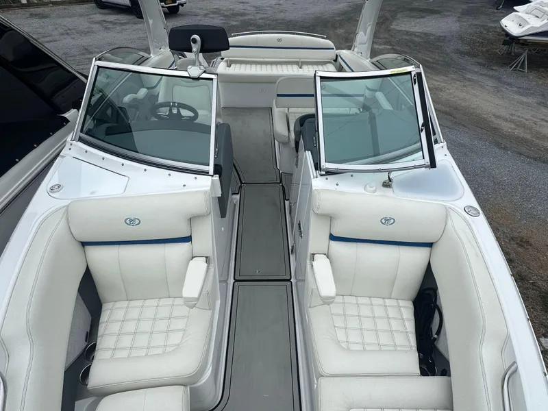 Slide: The Image of 2020 Cobalt R5 Surf boat interior with white leather seating and open windshield. - 10