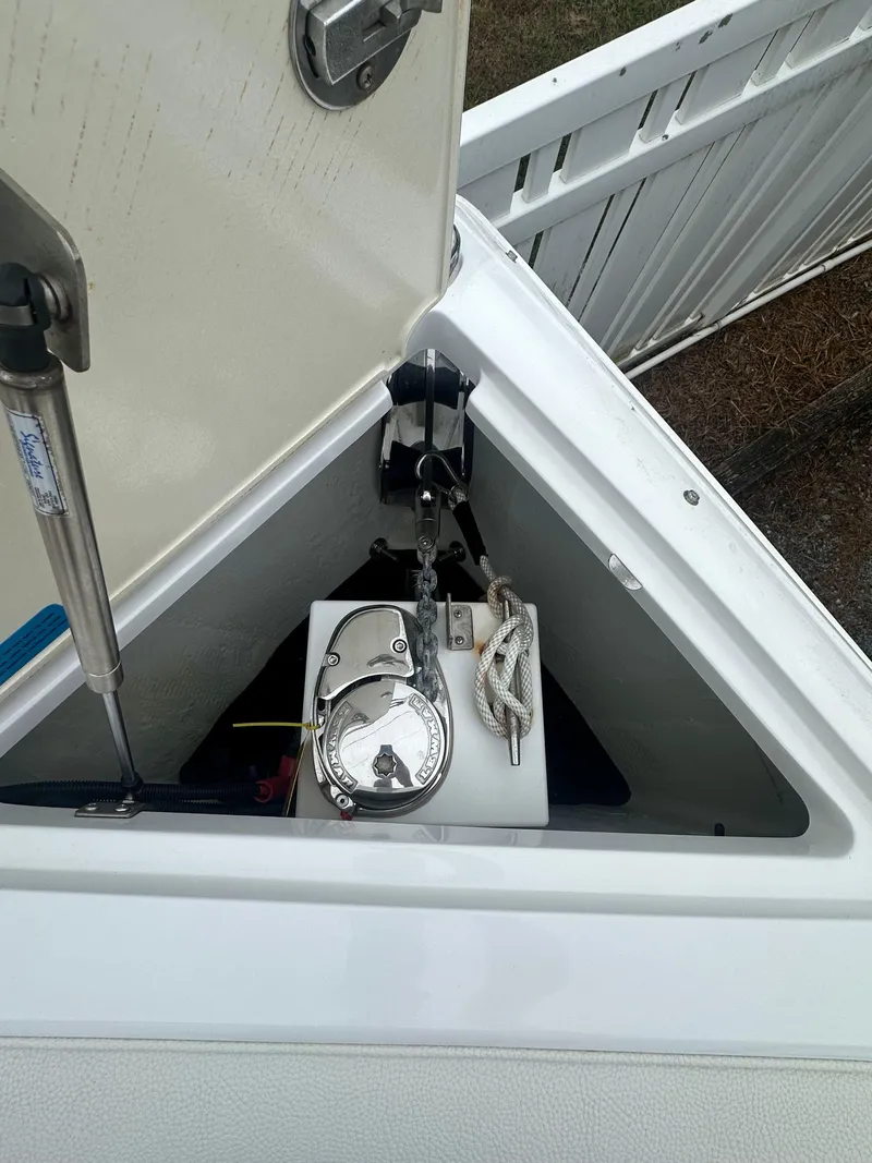 Slide: The Image of Anchor compartment of 2020 Cobalt R5 Surf boat with winch and rope. - 11