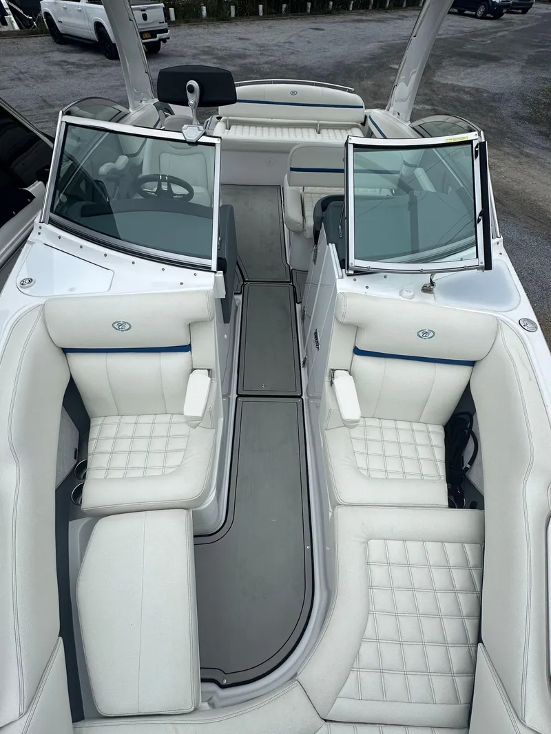 Slide: The Image of 2020 Cobalt R5 Surf boat interior with white leather seating and open windshield. - 9