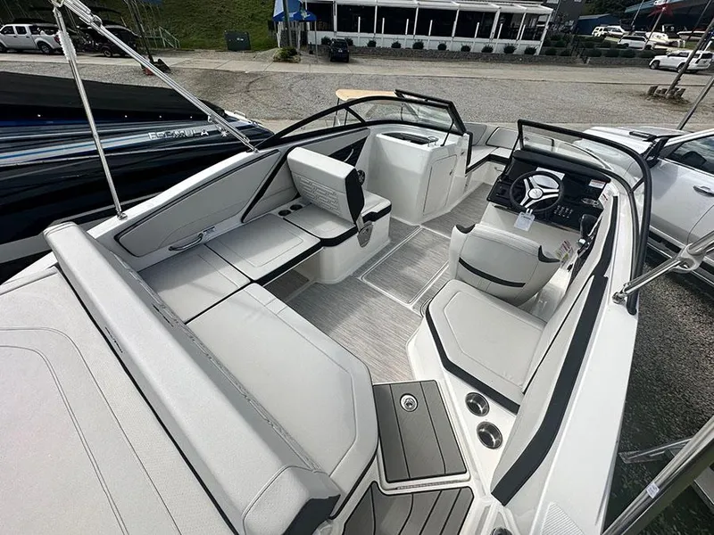 Slide: The Image of 2025 Sea Ray SPO 210 boat interior with sleek seating and modern dashboard. - 2