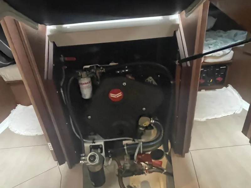 Slide: The Image of Engine compartment of a 2022 Beneteau Oceanis 38.1 sailboat, showcasing mechanical components. - 15