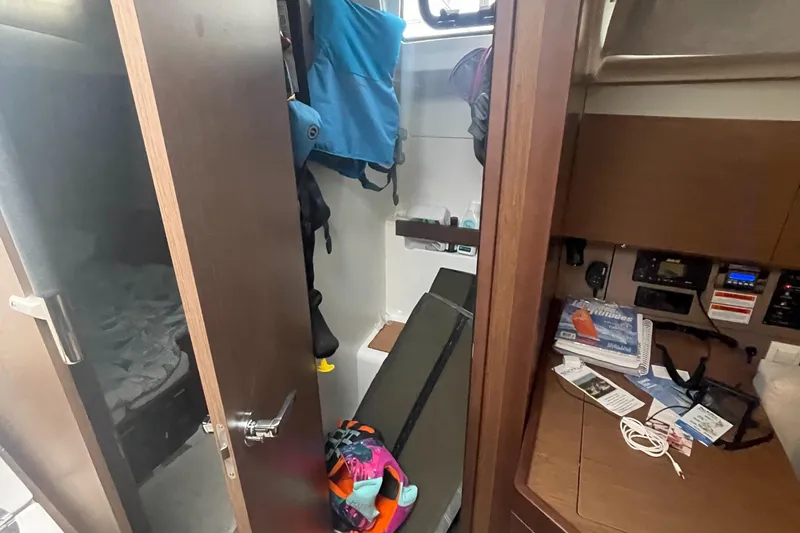 Slide: The Image of Interior cabin of 2022 Beneteau Oceanis 38.1 sailboat with storage and navigation equipment. - 25