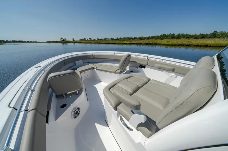 Slide: The Image of 2025 Sportsman Open 322 Center Console boat interior on calm water. - 20