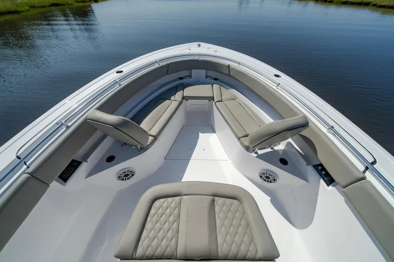Slide: The Image of 2025 Sportsman Open 322 Center Console boat with spacious seating on calm water. - 21