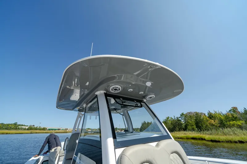 Slide: The Image of 2025 Sportsman Open 322 Center Console boat on a sunny day. - 23