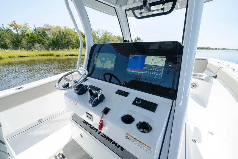 Slide: The Image of 2025 Sportsman Open 322 Center Console boat interior with advanced navigation system. - 25
