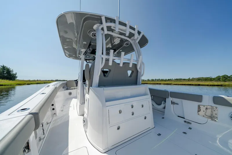 Slide: The Image of 2025 Sportsman Open 322 Center Console boat on calm water. - 34