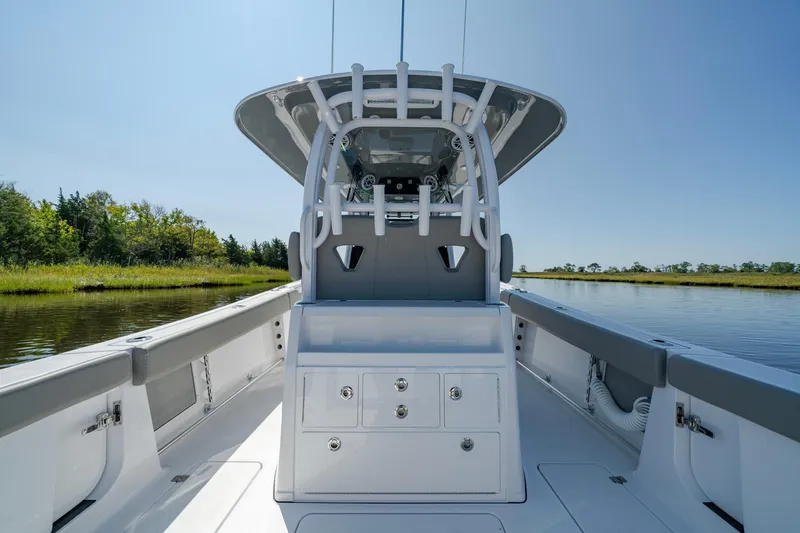 Slide: The Image of 2025 Sportsman Open 322 Center Console boat on calm water. - 35