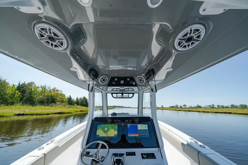Slide: The Image of 2025 Sportsman Open 322 Center Console boat interior with advanced navigation system. - 36
