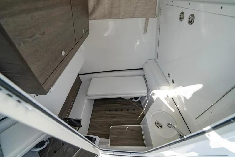 Slide: The Image of 2025 Sportsman Open 322 Center Console interior with wood accents and modern design. - 37