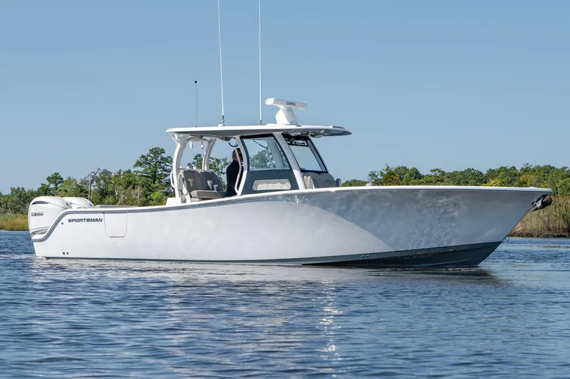 Slide: The Image of 2025 Sportsman Open 322 Center Console boat on calm water. - 7