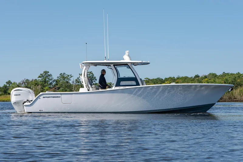 Slide: The Image of 2025 Sportsman Open 322 Center Console boat on calm water. - 9
