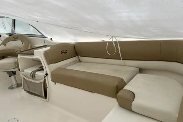 Slide: The Image of 2020 Key West 239 DFS boat interior with beige seating and helm. - 13