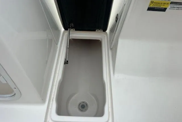 Slide: The Image of Open storage compartment on 2020 Key West 239 DFS boat. - 16