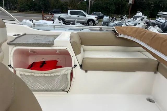 Slide: The Image of 2020 Key West 239 DFS boat interior with seating and storage compartment. - 5