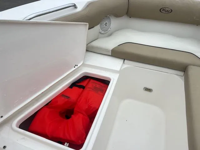 Slide: The Image of 2020 Key West 239 DFS boat with red life jacket in storage compartment. - 9
