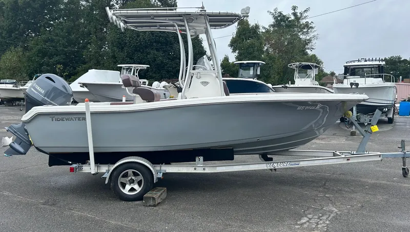 Slide: The Image of 2017 Tidewater 198 CC Adventure boat on trailer in parking lot. - 1