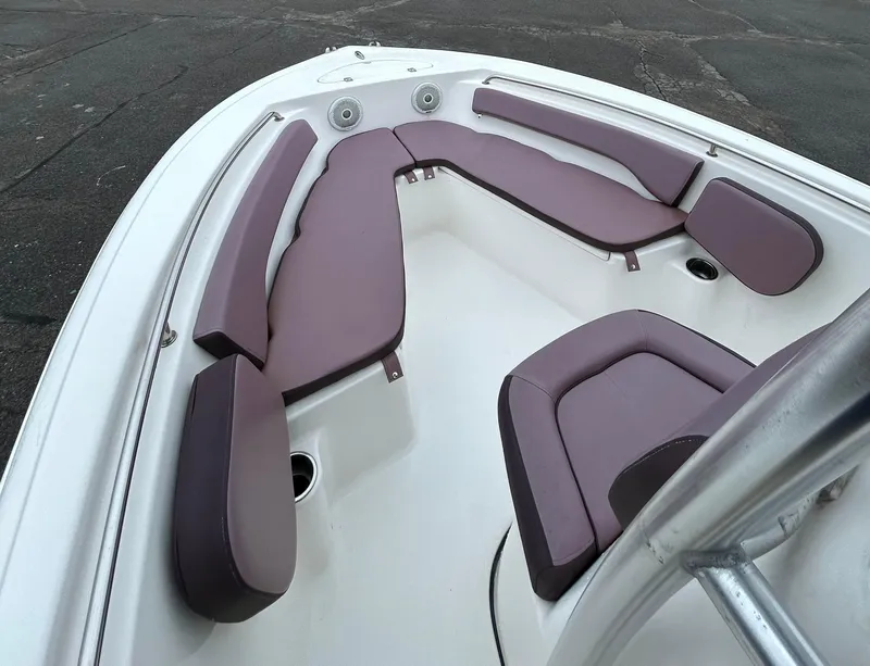 Slide: The Image of 2017 Tidewater 198 CC Adventure boat interior with cushioned seating. - 11