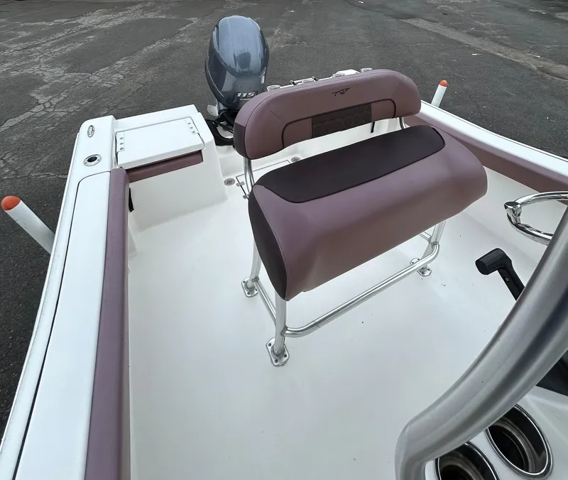 Slide: The Image of 2017 Tidewater 198 CC Adventure boat interior with seating and motor. - 13