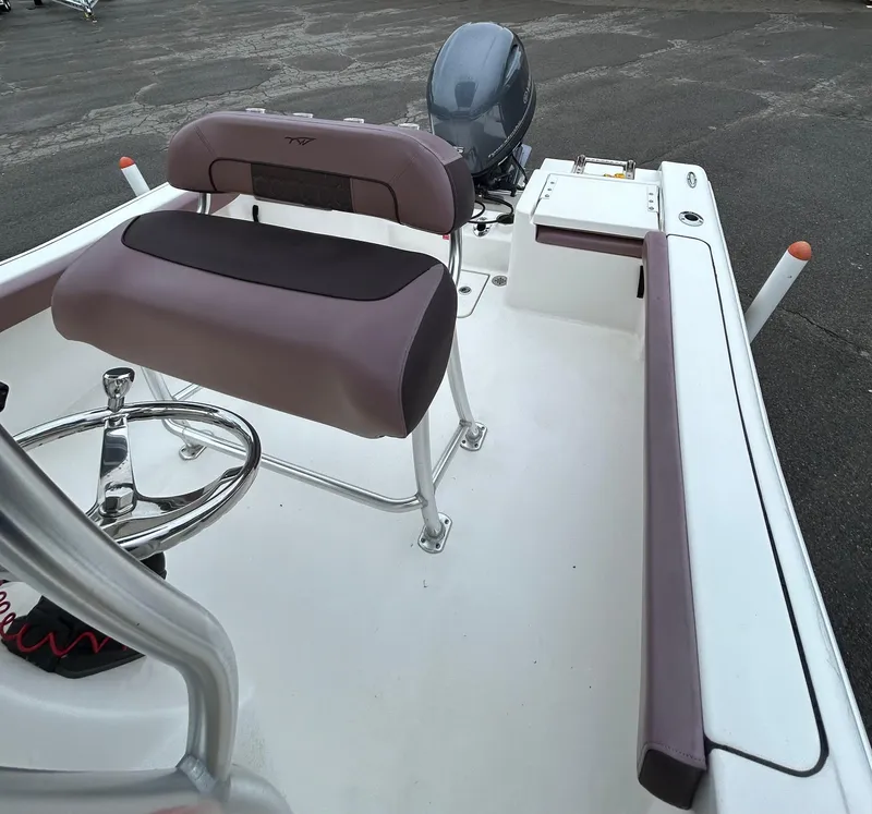 Slide: The Image of 2017 Tidewater 198 CC Adventure boat interior with seating and steering wheel. - 14
