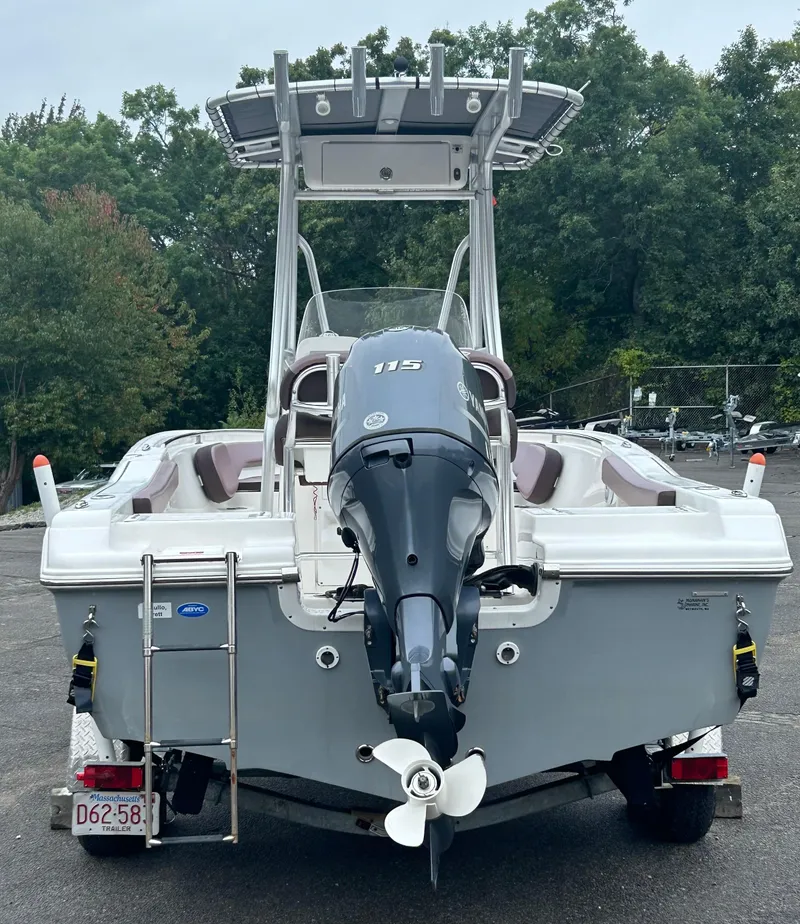 Slide: The Image of 2017 Tidewater 198 CC Adventure boat with outboard motor, parked on a trailer. - 15