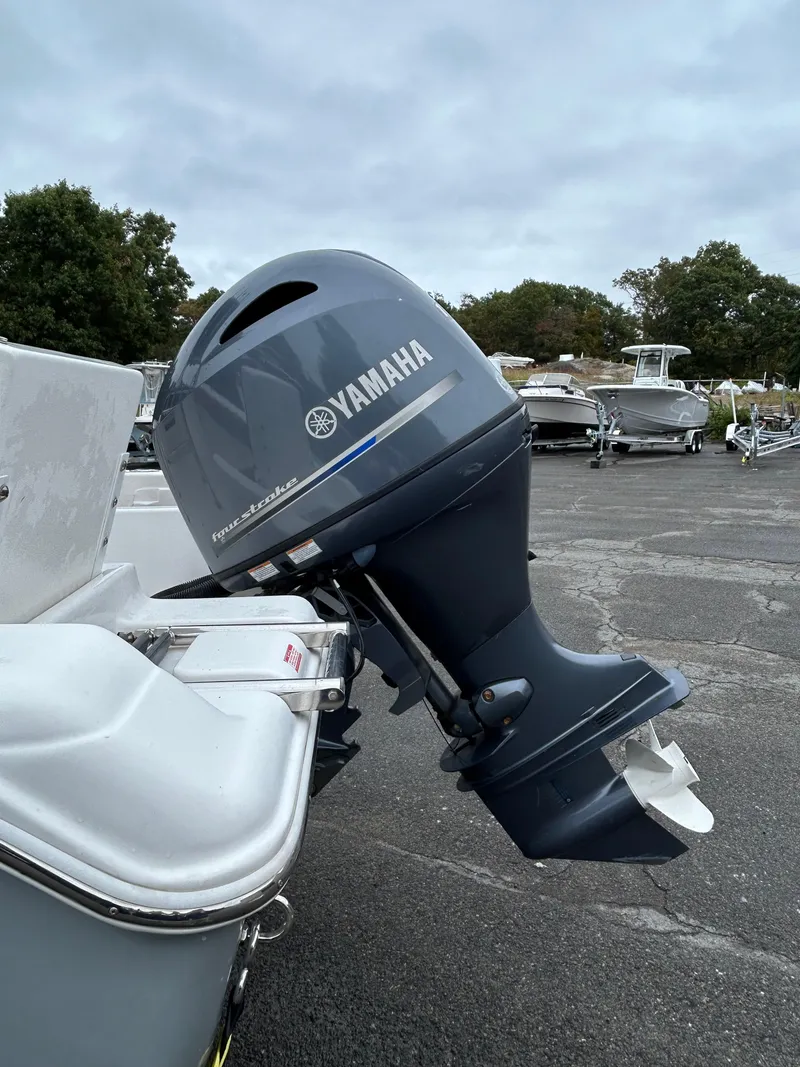 Slide: The Image of 2017 Tidewater 198 CC Adventure with Yamaha outboard motor in a boatyard. - 16