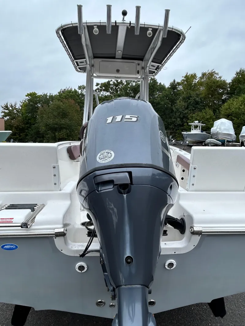 Slide: The Image of 2017 Tidewater 198 CC Adventure boat with 115 horsepower outboard motor, rear view. - 17