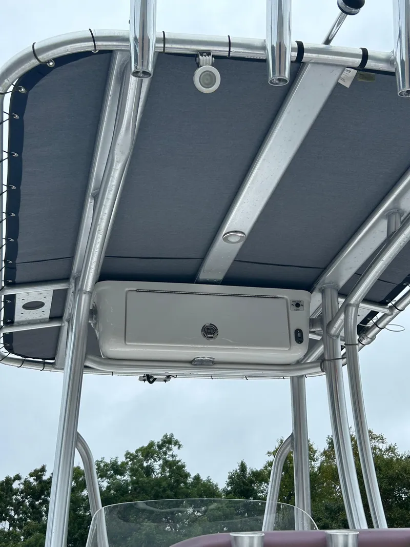 Slide: The Image of 2017 Tidewater 198 CC Adventure boat T-top with storage compartment. - 18