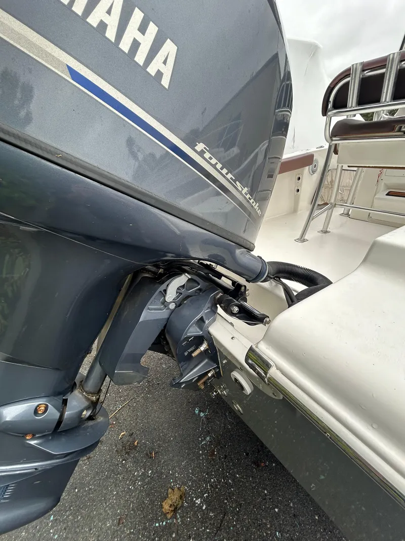 Slide: The Image of 2017 Tidewater 198 CC Adventure with Yamaha outboard motor, docked on pavement. - 20