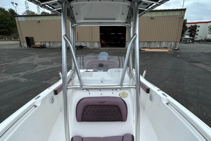 Slide: The Image of 2017 Tidewater 198 CC Adventure boat interior with T-top and seating. - 22