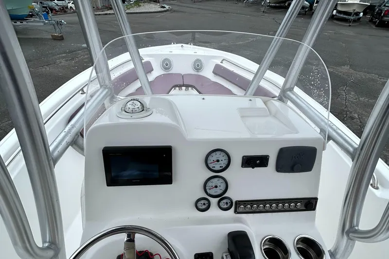 Slide: The Image of 2017 Tidewater 198 CC Adventure boat dashboard with gauges and controls. - 23