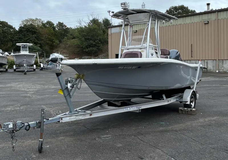 Slide: The Image of 2017 Tidewater 198 CC Adventure boat on trailer in parking lot. - 4
