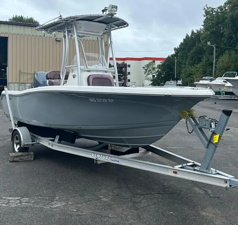 Slide: The Image of 2017 Tidewater 198 CC Adventure boat on trailer in parking lot. - 7