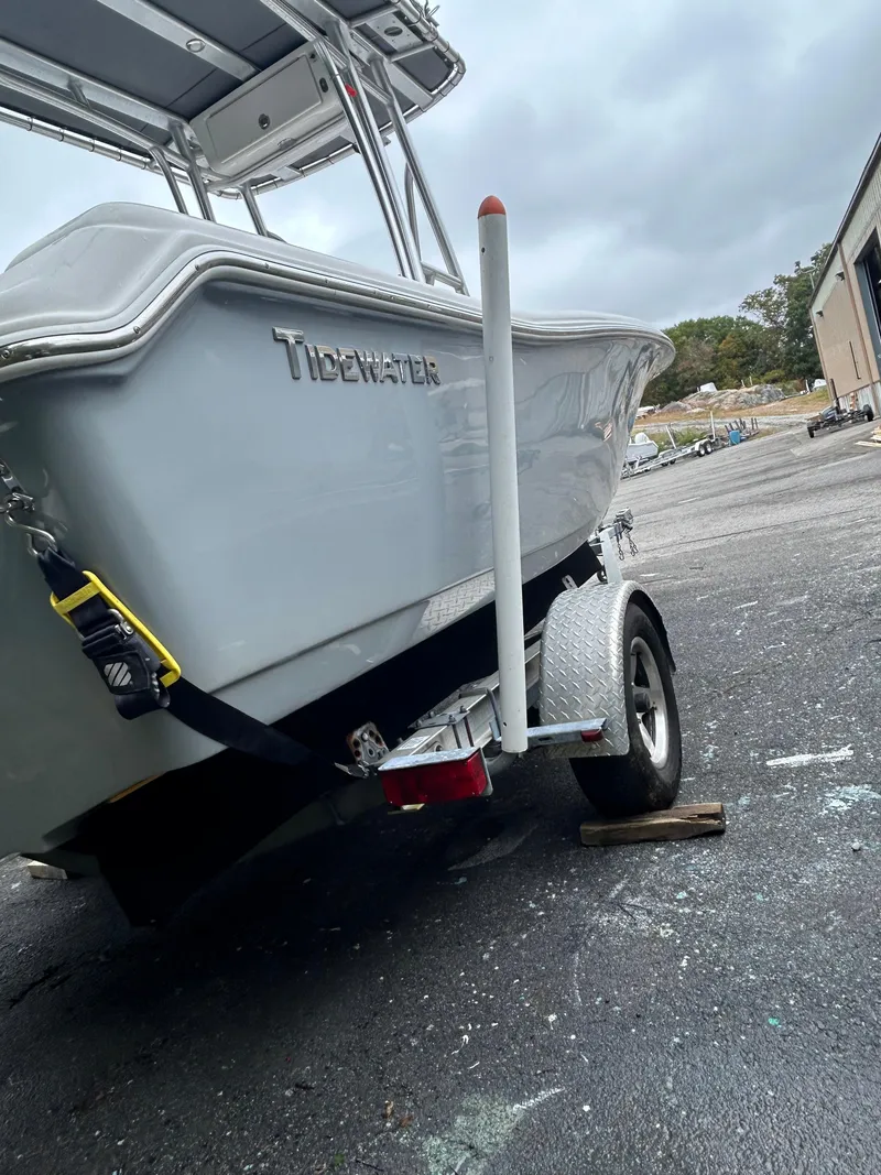 Slide: The Image of 2017 Tidewater 198 CC Adventure boat on trailer, parked outdoors. - 9