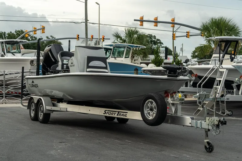 Slide: The Image of 2025 Turner Boatworks 2500 VS on trailer at marina, ready for launch. - 1