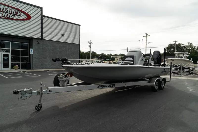 Slide: The Image of 2025 Turner Boatworks 2500 VS on trailer outside dealership. - 4