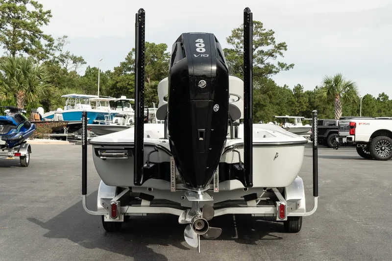 Slide: The Image of 2025 Turner Boatworks 2500 VS with powerful outboard motor, parked on a trailer. - 5