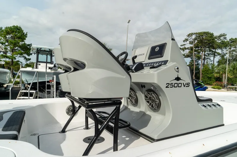Slide: The Image of 2025 Turner Boatworks 2500 VS, sleek design, modern console, outdoor setting. - 8