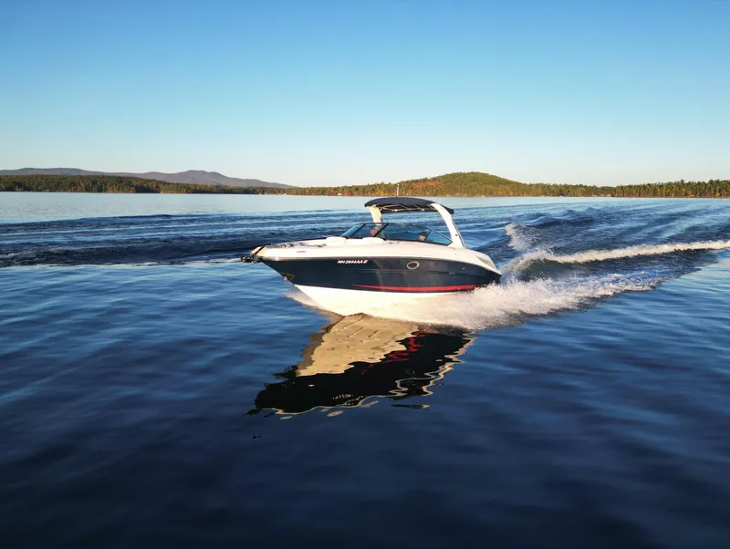 Slide: The Image of 2015 Sea Ray 300 SLX cruising on a serene lake. - 15