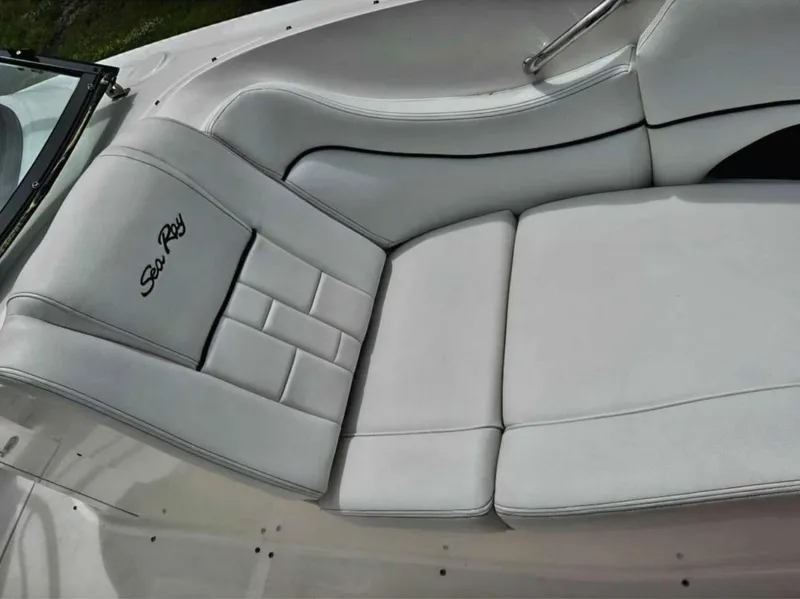 Slide: The Image of 2015 Sea Ray 300 SLX boat with white leather seating and logo. - 25