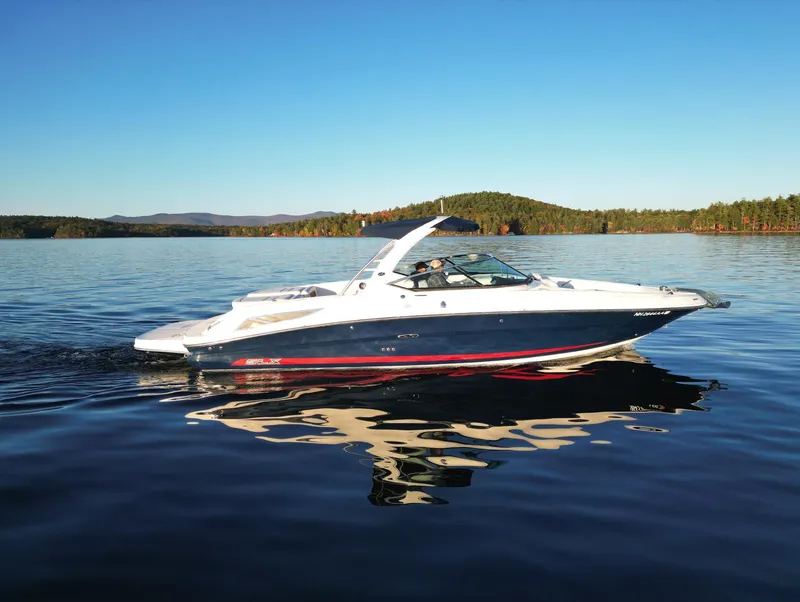 Slide: The Image of 2015 Sea Ray 300 SLX boat cruising on a serene lake. - 3