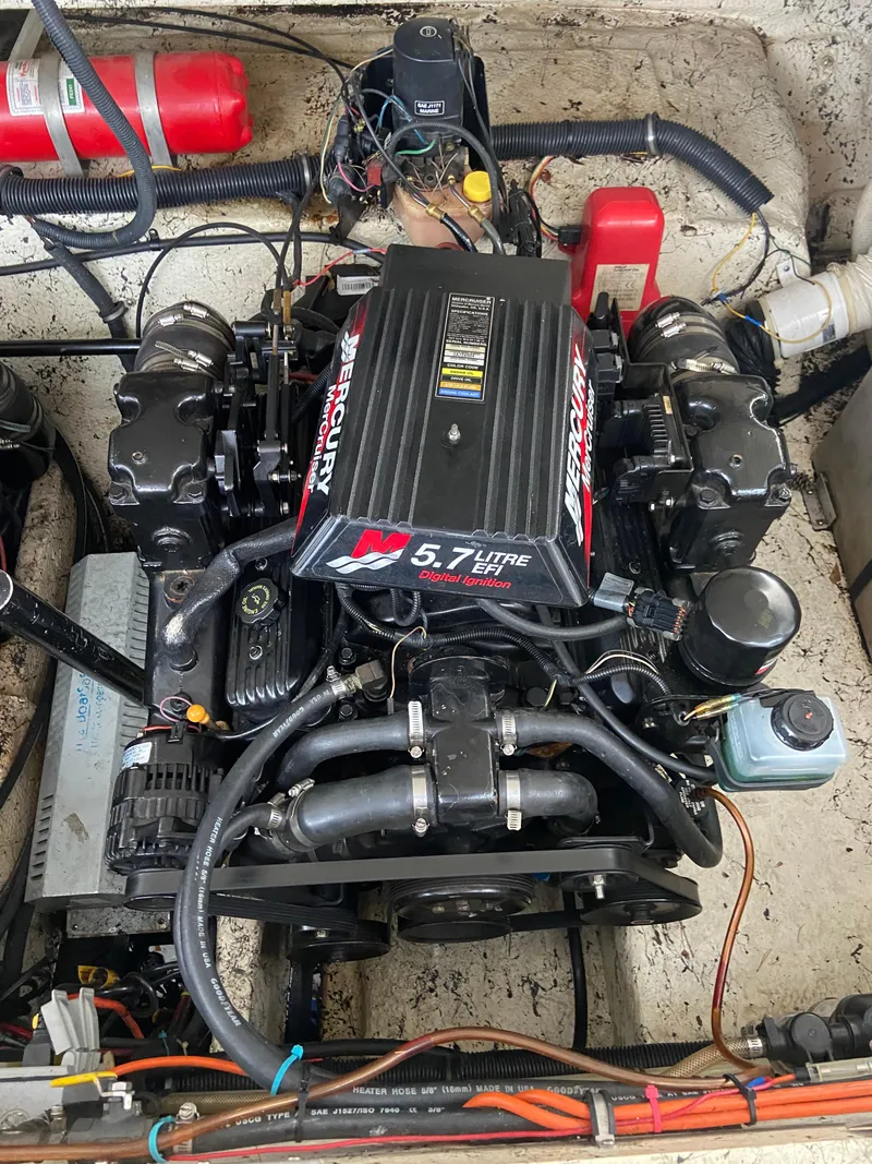 Slide: The Image of Engine compartment of a 2000 Rinker 340 Fiesta Vee with a 5.7L Mercury engine. - 27