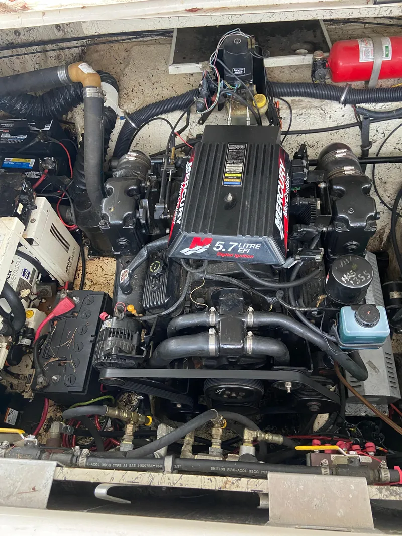 Slide: The Image of Engine compartment of a 2000 Rinker 340 Fiesta Vee with a 5.7L MerCruiser engine. - 28