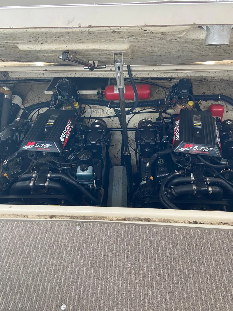 Slide: The Image of Twin engines in a 2000 Rinker 340 Fiesta Vee boat. - 27